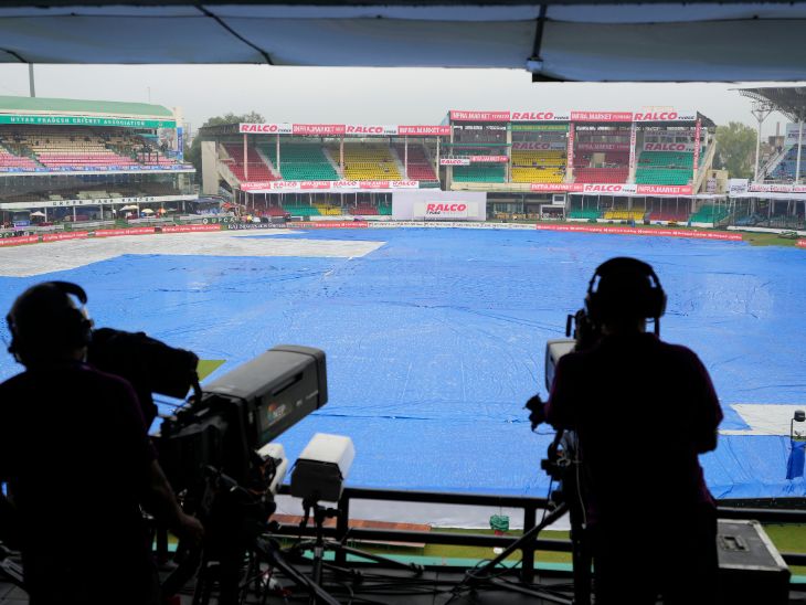 Camera persons waiting for the match to start.