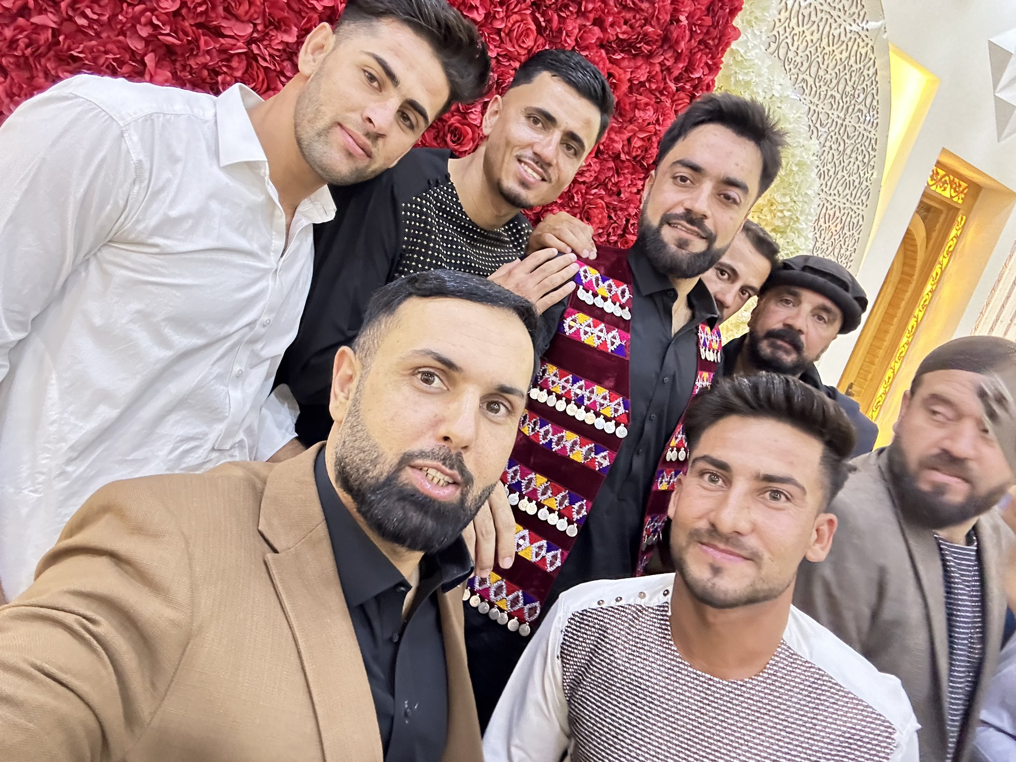 Rashid's fellow cricketers taking selfie with him.