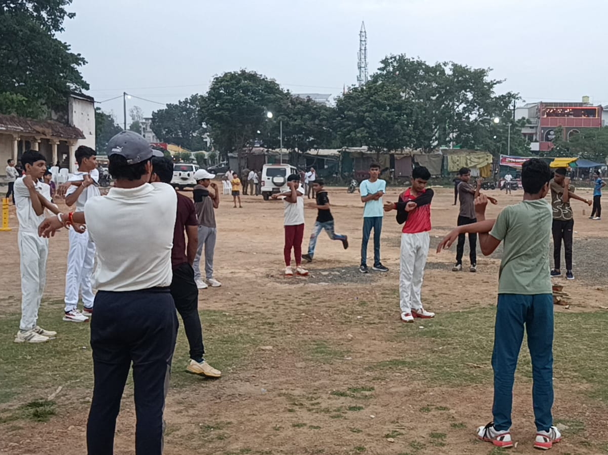 Players of Under-15 cricket team practicing.